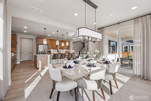 18019 139th Pl E Unit 19, Puyallup, WA 98374 - dining area featuring recessed lighting, light wood-style floors, and stairway