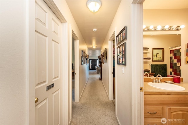 70 Onyx Ln, Sequim, WA 98382 - hall featuring a sink and baseboards