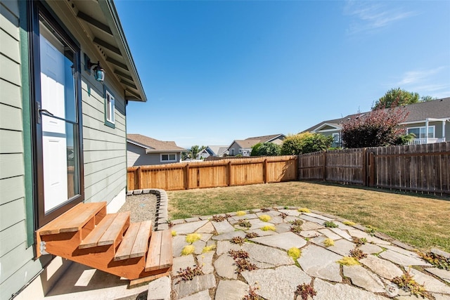 70 Onyx Ln, Sequim, WA 98382 - fenced backyard with a patio area, entry steps, and a residential view