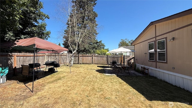 10426 11th Avenue Ct S, Tacoma, WA 98444 - fenced backyard with a patio area