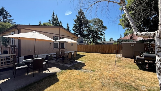 10426 11th Avenue Ct S, Tacoma, WA 98444 - fenced backyard with a patio area