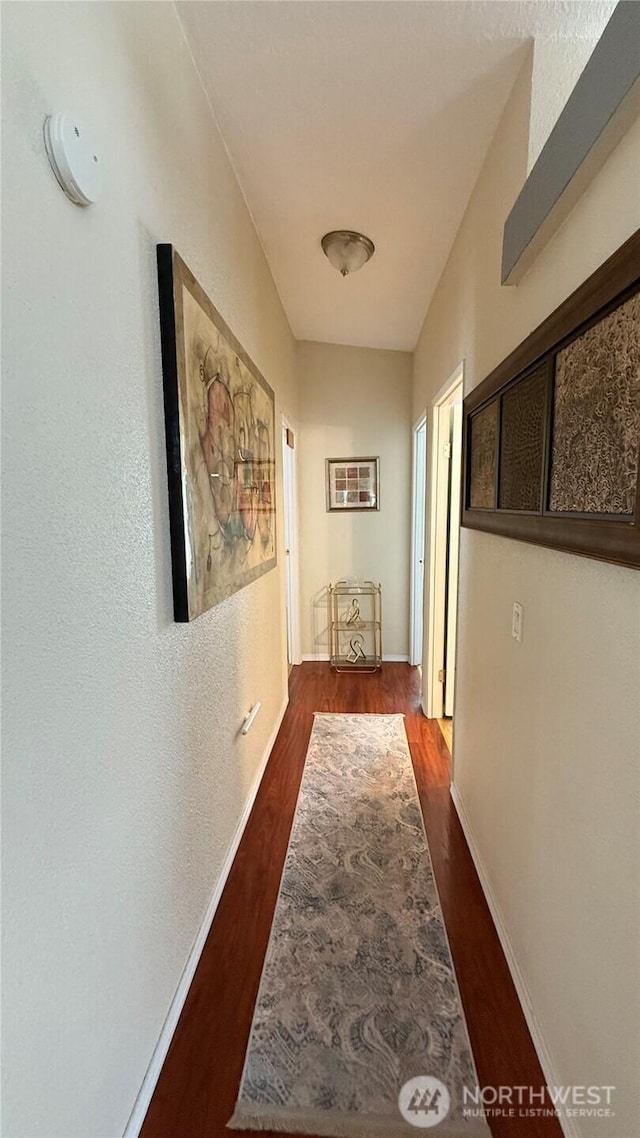 10426 11th Avenue Ct S, Tacoma, WA 98444 - hallway featuring dark wood finished floors