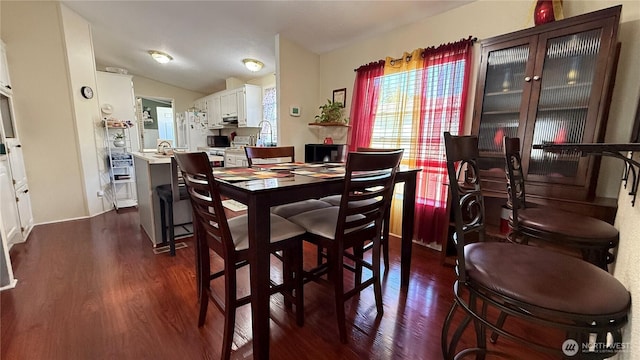 10426 11th Avenue Ct S, Tacoma, WA 98444 - dining room featuring dark wood-style floors and lofted ceiling