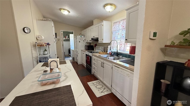 10426 11th Avenue Ct S, Tacoma, WA 98444 - kitchen featuring electric stove, dishwasher, white cabinetry, vaulted ceiling, and dark wood-type flooring