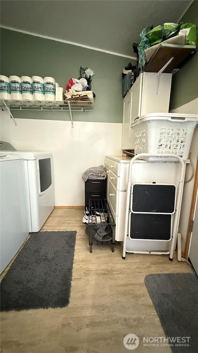 10426 11th Avenue Ct S, Tacoma, WA 98444 - laundry area featuring independent washer and dryer and light wood-style flooring