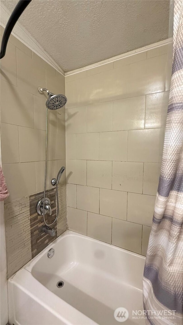 10426 11th Avenue Ct S, Tacoma, WA 98444 - bathroom featuring shower / bath combo with shower curtain and a textured ceiling