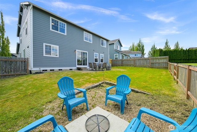 6209 Lincoln Dr, Ferndale, WA 98248 - rear view of house with a patio area, a fenced backyard, crawl space, and a fire pit