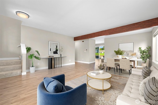 6209 Lincoln Dr, Ferndale, WA 98248 - living area featuring wood finished floors, beam ceiling, and stairs