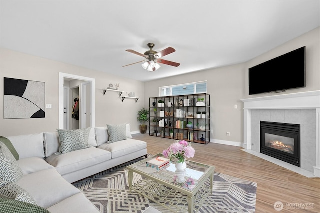 6209 Lincoln Dr, Ferndale, WA 98248 - living room featuring wood finished floors, a ceiling fan, and a fireplace