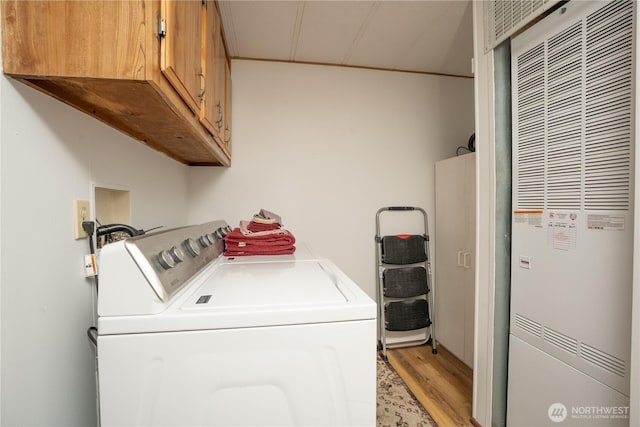3611 I St NE Unit 10, Auburn, WA 98002 - laundry area with a heating unit, light wood-style flooring, cabinet space, and washing machine and dryer