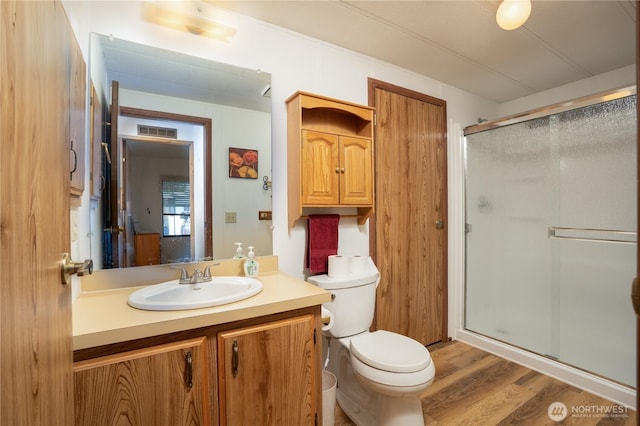 3611 I St NE Unit 10, Auburn, WA 98002 - bathroom with a stall shower, vanity, and wood finished floors