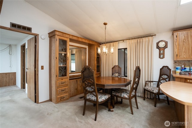 3611 I St NE Unit 10, Auburn, WA 98002 - dining area featuring a chandelier, light colored carpet, and lofted ceiling