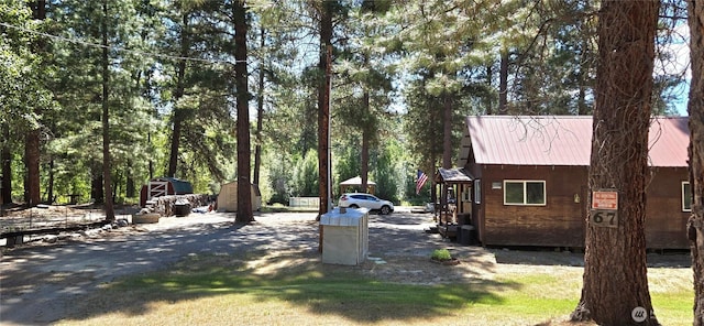 67 Northcott Rd, Winthrop, WA 98862 - view of home's exterior with a metal roof and a storage shed