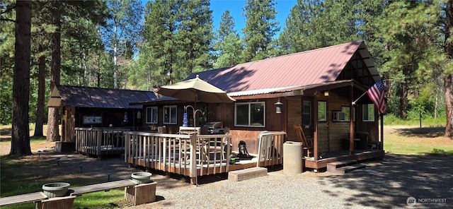 67 Northcott Rd, Winthrop, WA 98862 - back of property with a metal roof and a deck