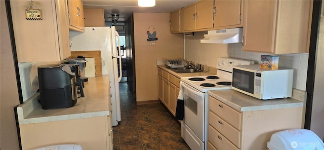 67 Northcott Rd, Winthrop, WA 98862 - kitchen with white electric range oven, backsplash, under cabinet range hood, and light countertops