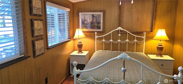 67 Northcott Rd, Winthrop, WA 98862 - bedroom featuring multiple windows, wooden walls, and wood finished floors