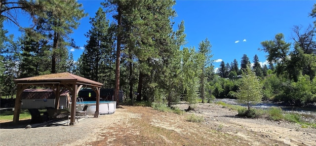 67 Northcott Rd, Winthrop, WA 98862 - view of yard featuring a gazebo, an outdoor pool, and a view of trees