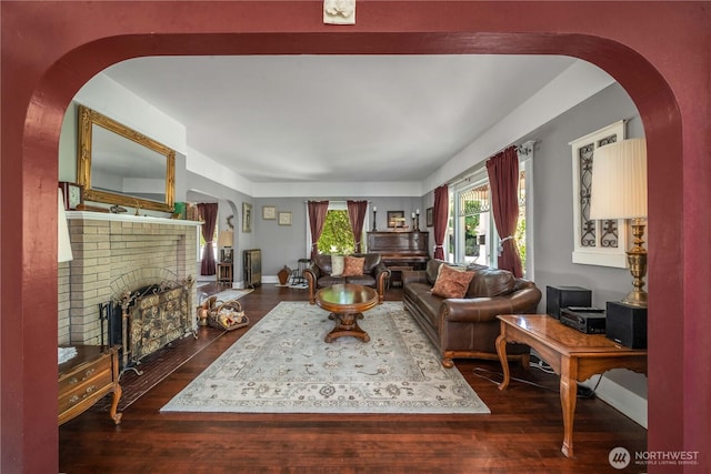 1721 N Steele St, Tacoma, WA 98406 - living room with a fireplace, dark wood finished floors, and arched walkways