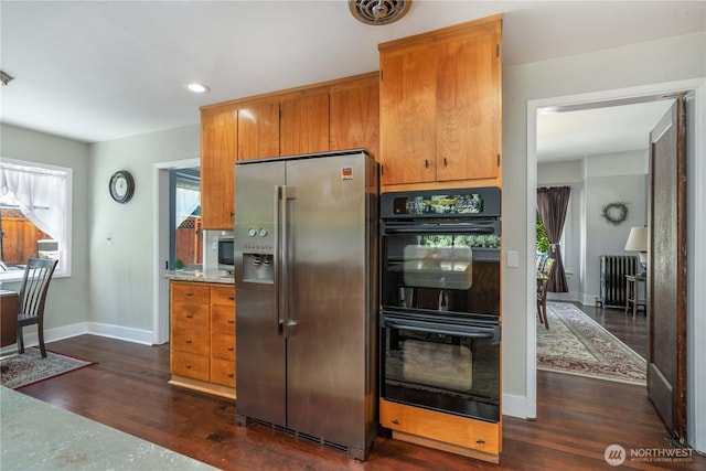 1721 N Steele St, Tacoma, WA 98406 - kitchen featuring stainless steel fridge with ice dispenser, radiator heating unit, healthy amount of natural light, dark wood-style floors, and recessed lighting