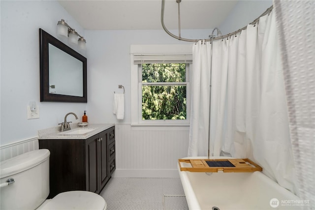 1721 N Steele St, Tacoma, WA 98406 - bathroom with wainscoting, vanity, a shower with curtain, and tile patterned floors