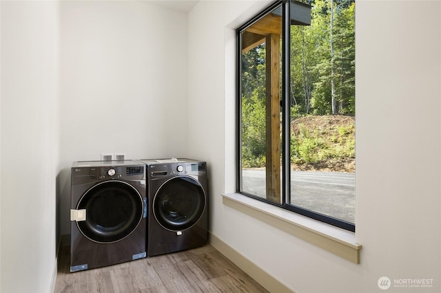 1450 Nelson Siding, Cle Elum, WA 98922 - washroom featuring washer and clothes dryer and wood finished floors