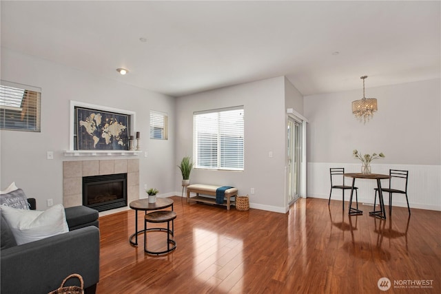 2025 Palisade Blvd, Dupont, WA 98327 - living area featuring a chandelier, wood finished floors, and a fireplace