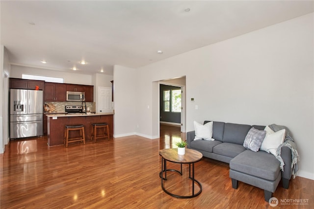 2025 Palisade Blvd, Dupont, WA 98327 - living area with dark wood-type flooring and recessed lighting