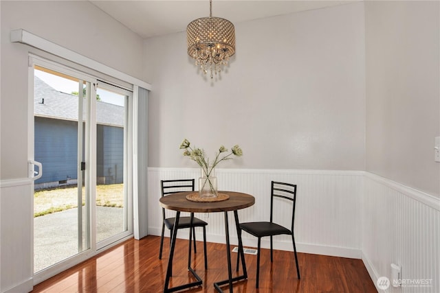 2025 Palisade Blvd, Dupont, WA 98327 - dining room with wainscoting, wood finished floors, and a chandelier