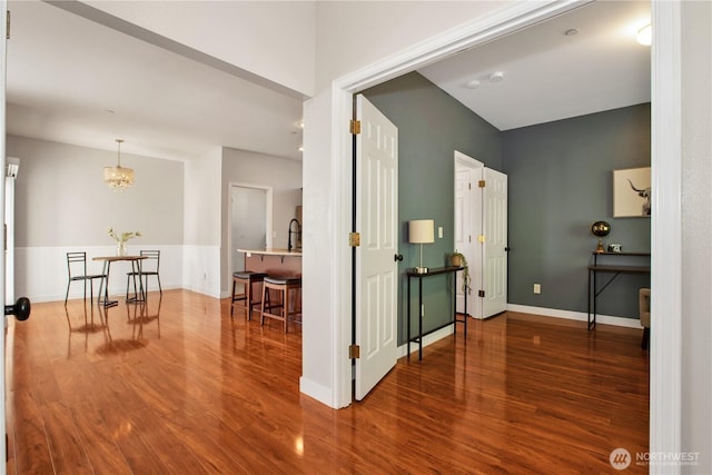 2025 Palisade Blvd, Dupont, WA 98327 - corridor featuring wood finished floors and a chandelier