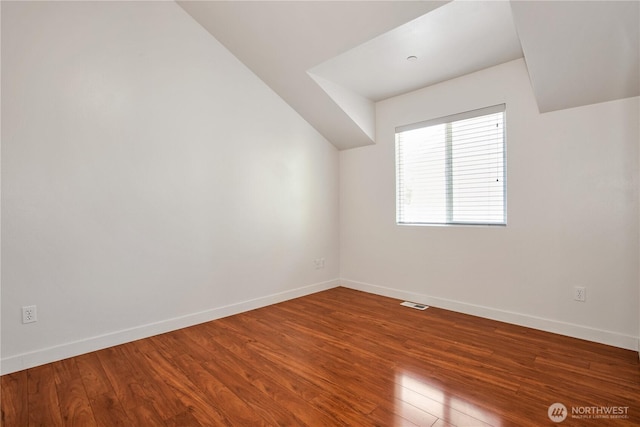 2025 Palisade Blvd, Dupont, WA 98327 - additional living space with wood finished floors and vaulted ceiling