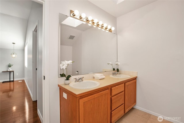 2025 Palisade Blvd, Dupont, WA 98327 - full bathroom featuring double vanity and baseboards