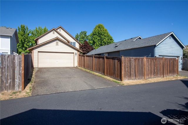 2025 Palisade Blvd, Dupont, WA 98327 - view of side of home with a garage