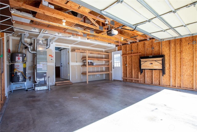 2025 Palisade Blvd, Dupont, WA 98327 - garage featuring gas water heater, a garage door opener, and heating unit