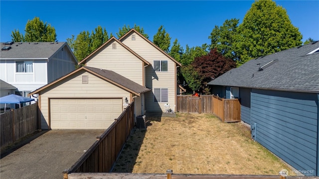 2025 Palisade Blvd, Dupont, WA 98327 - view of home's exterior featuring a garage and driveway