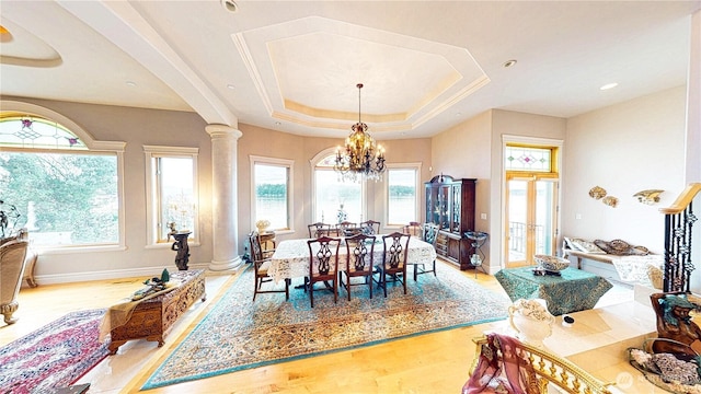 2837 E Lake Sammamish Pkwy NE, Sammamish, WA 98074 - dining space with plenty of natural light, a chandelier, decorative columns, and wood finished floors