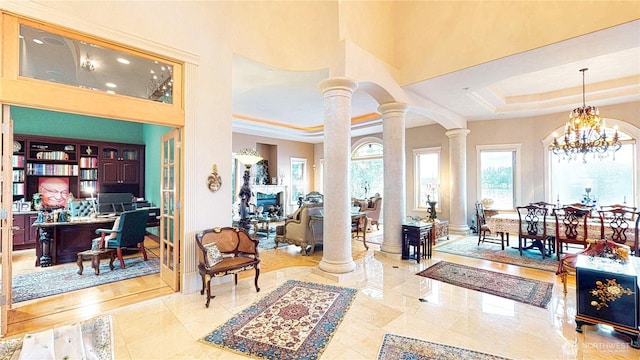 2837 E Lake Sammamish Pkwy NE, Sammamish, WA 98074 - entrance foyer featuring ornate columns, a raised ceiling, a towering ceiling, and a chandelier