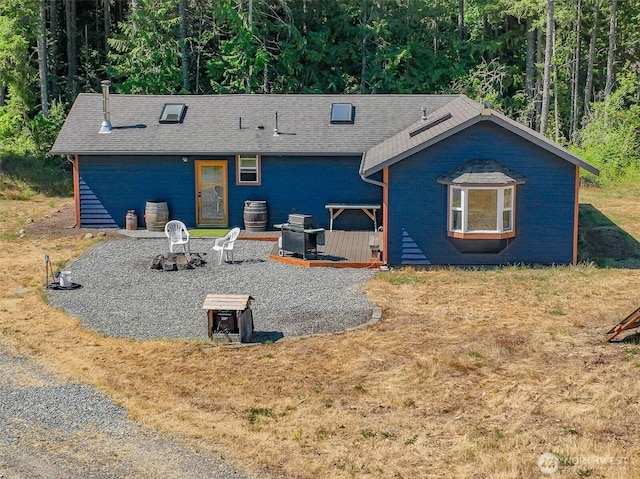 19002 Sorenson Rd SE, Yelm, WA 98597 - back of house with a wooded view and a yard
