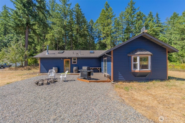 19002 Sorenson Rd SE, Yelm, WA 98597 - view of front of home with a wooden deck and a chimney