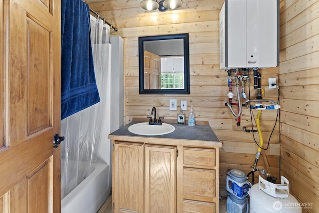 19002 Sorenson Rd SE, Yelm, WA 98597 - full bathroom featuring tankless water heater, wooden walls, vanity, and shower / bath combo