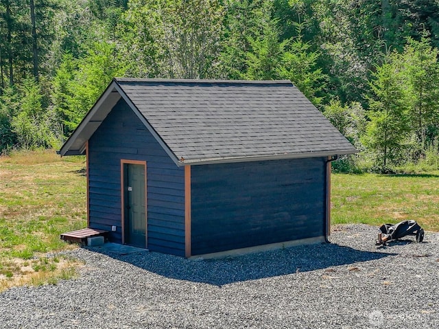 19002 Sorenson Rd SE, Yelm, WA 98597 - garage featuring a view of trees