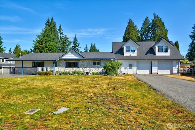 3711 116th St SE, Everett, WA 98208 - view of front of house with stone siding, a front lawn, driveway, and a garage