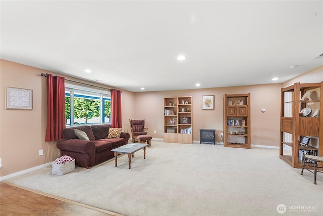 3711 116th St SE, Everett, WA 98208 - living area with a wood stove, recessed lighting, and light carpet