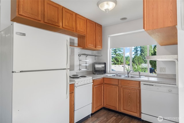 3711 116th St SE, Everett, WA 98208 - kitchen featuring white appliances, dark wood-style flooring, light countertops, and brown cabinets