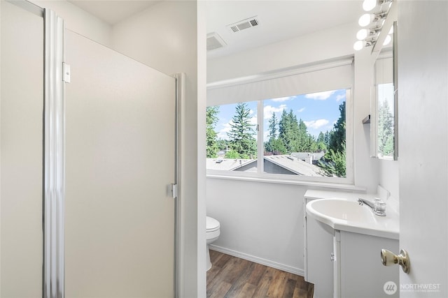 3711 116th St SE, Everett, WA 98208 - bathroom with vanity, wood finished floors, and a shower with door