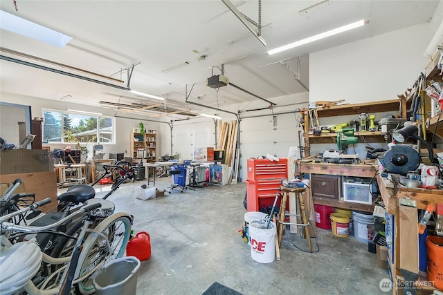 3711 116th St SE, Everett, WA 98208 - garage featuring a garage door opener and a workshop area