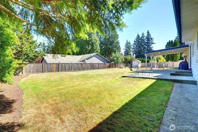 3711 116th St SE, Everett, WA 98208 - fenced backyard with a shed and a patio area