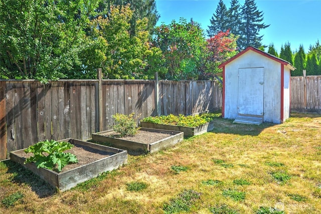3711 116th St SE, Everett, WA 98208 - fenced backyard featuring a vegetable garden and a shed