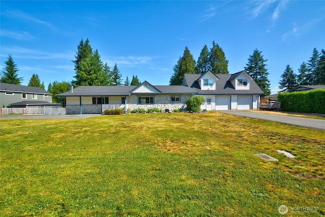 3711 116th St SE, Everett, WA 98208 - view of front of home featuring asphalt driveway, a garage, a front lawn, and stone siding