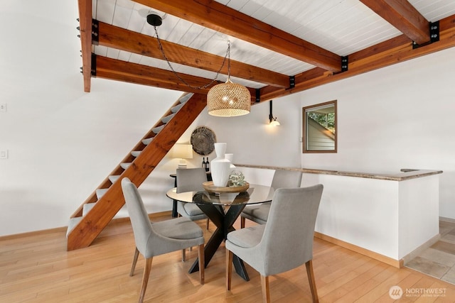 10036 NE 115th Ln Unit A3, Kirkland, WA 98033 - dining room featuring stairs, wood finished floors, and a wooden ceiling with exposed beams