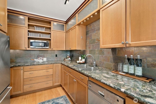 10036 NE 115th Ln Unit A3, Kirkland, WA 98033 - kitchen featuring appliances with stainless steel finishes, light wood-style flooring, decorative backsplash, open shelves, and dark stone counters